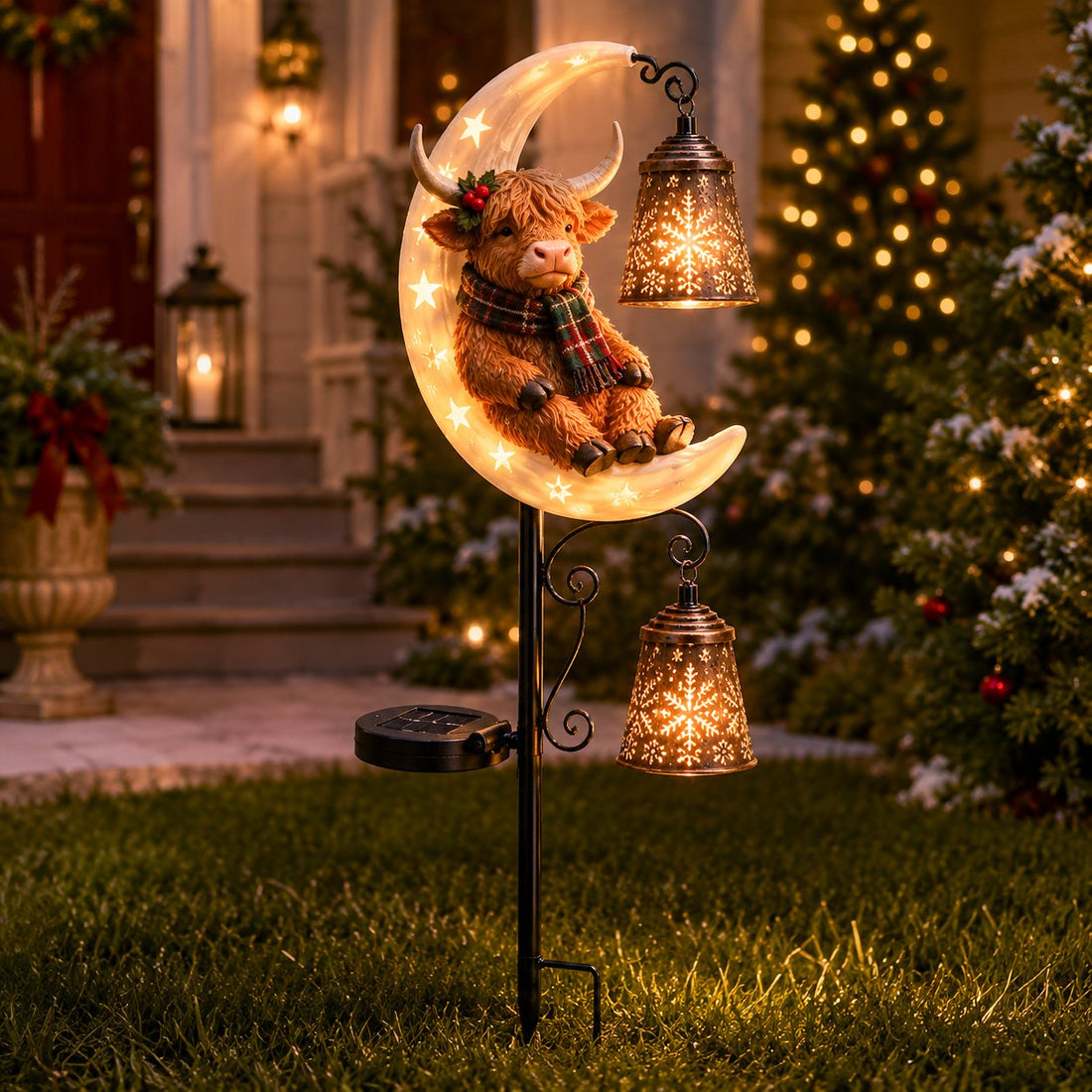Highland Cow Moon Solar Light in a warm Christmas yard